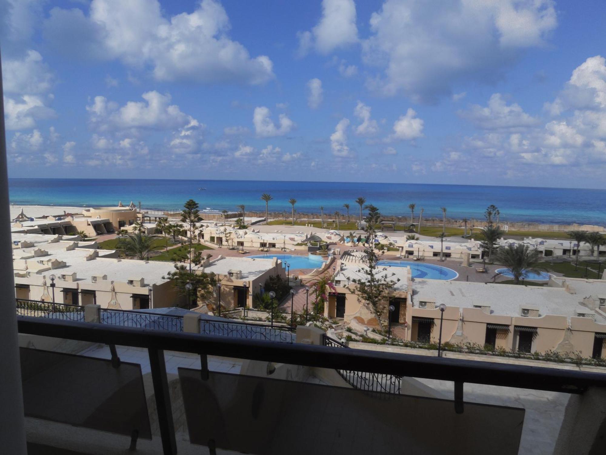 Borg El Arab Beach Resort Exterior photo View of the beach from the hotel