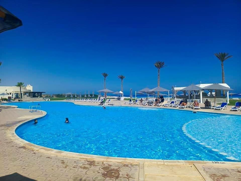 Borg El Arab Beach Resort Exterior photo A swimming pool at a resort in Egypt