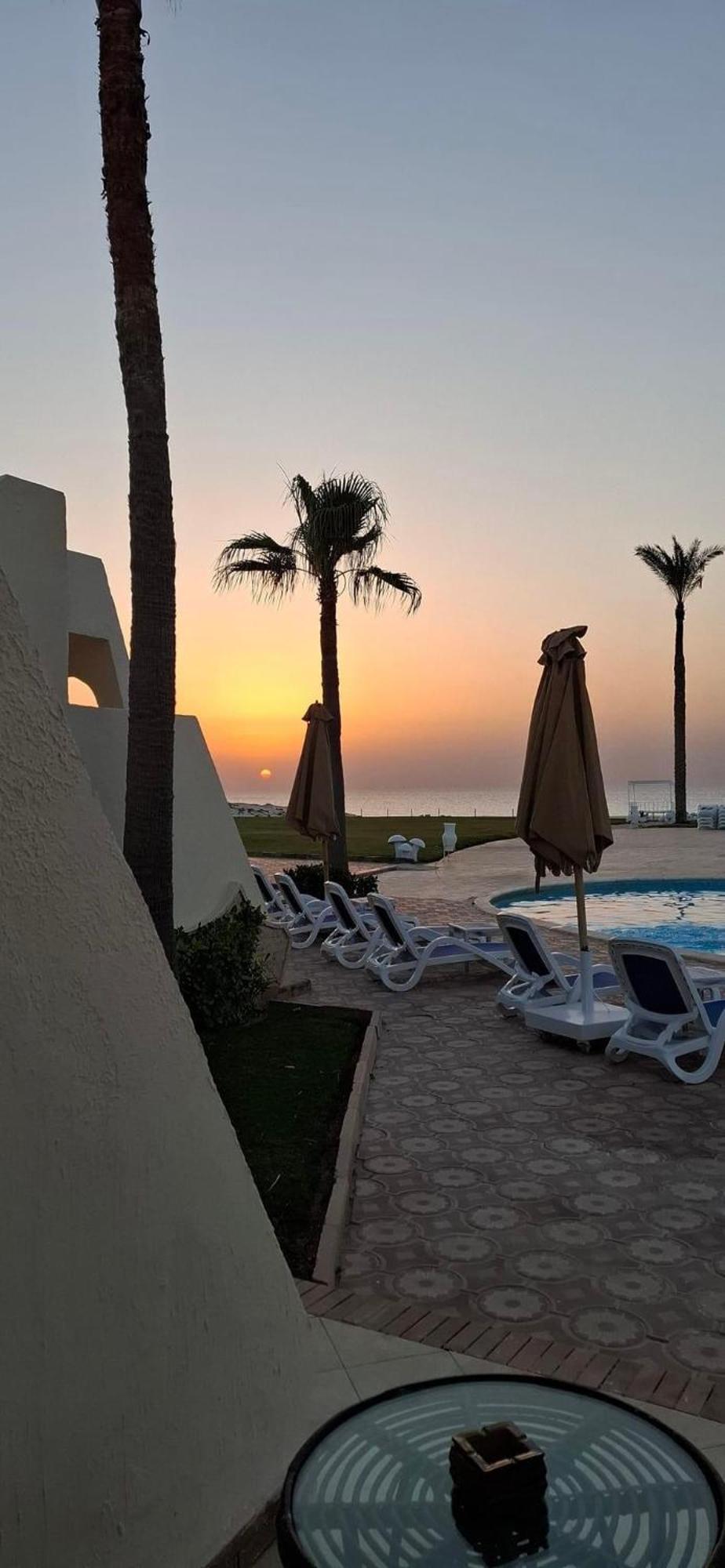 Borg El Arab Beach Resort Exterior photo Sunset at the hotel
